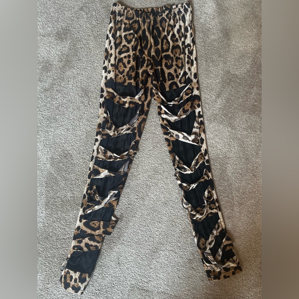Leopard printed leggings with see-through fabric in front.